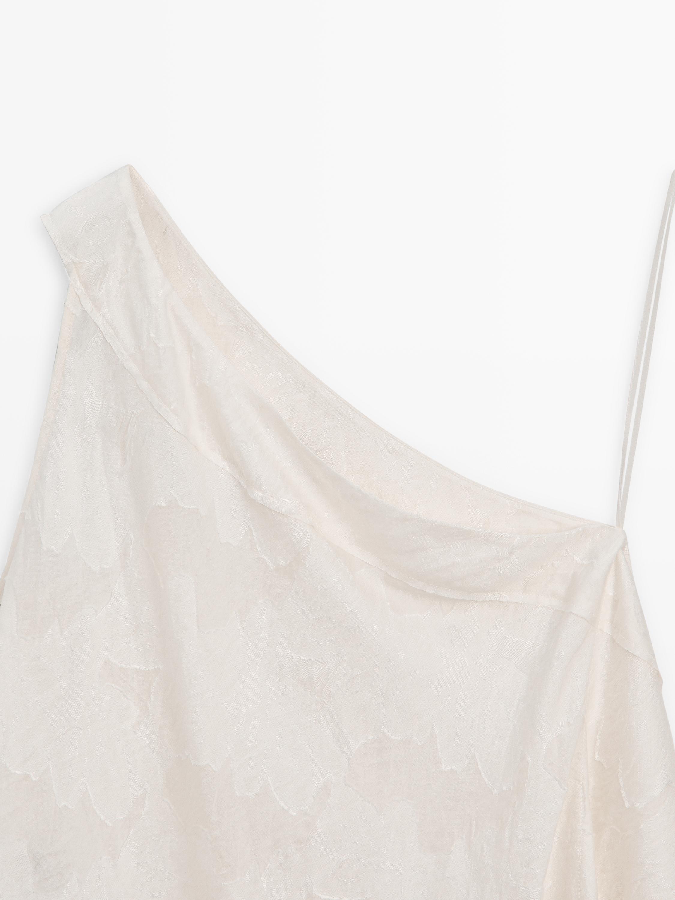 Top with asymmetric neckline